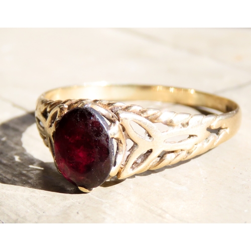 478 - Red Garnet Single Stone Ring Celtic Motif Mounted in 9 Carat Yellow Gold Ring Size U and a Half