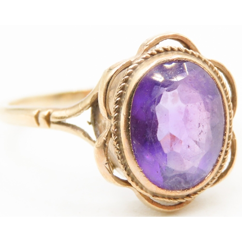 497 - Amethyst Bezel Set Single Stone Ring Mounted in 9 Carat Yellow Gold Ring Size O