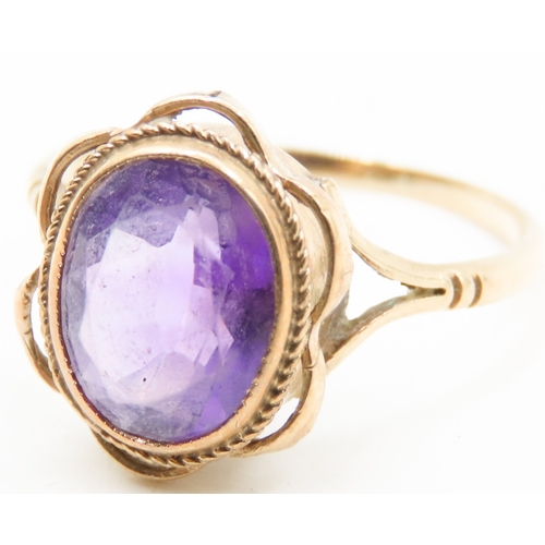 497 - Amethyst Bezel Set Single Stone Ring Mounted in 9 Carat Yellow Gold Ring Size O