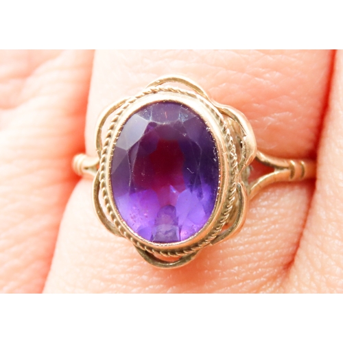 497 - Amethyst Bezel Set Single Stone Ring Mounted in 9 Carat Yellow Gold Ring Size O