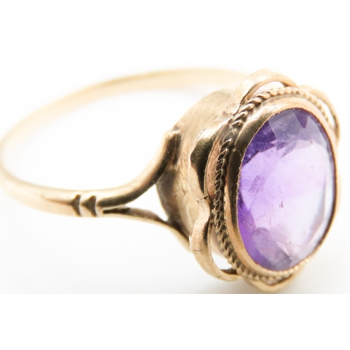 497 - Amethyst Bezel Set Single Stone Ring Mounted in 9 Carat Yellow Gold Ring Size O