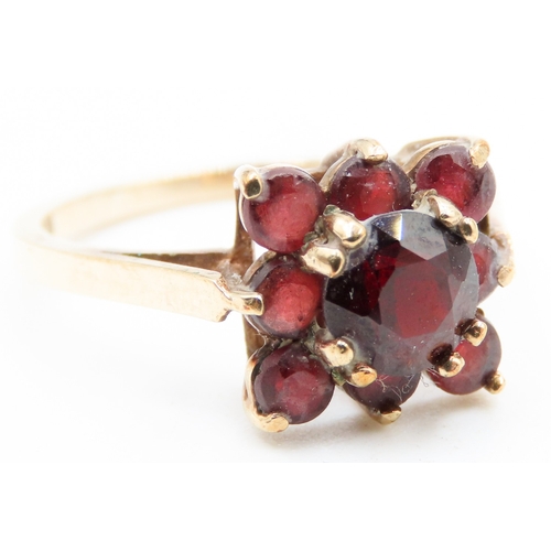 517 - Red Garnet Set Cluster Ring Mounted in 9 Carat Yellow Gold Ring Size N