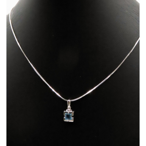 521 - Bezel Set Sky Blue Topaz and Diamond Set Pendant Mounted in 9 Carat White Gold set on 18 Carat White... 