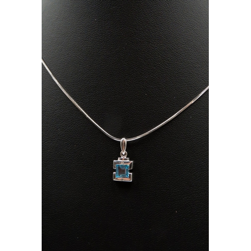 521 - Bezel Set Sky Blue Topaz and Diamond Set Pendant Mounted in 9 Carat White Gold set on 18 Carat White... 