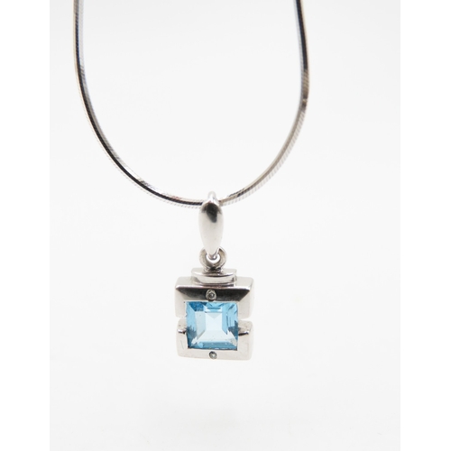 521 - Bezel Set Sky Blue Topaz and Diamond Set Pendant Mounted in 9 Carat White Gold set on 18 Carat White... 