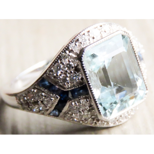 532 - Emerald Cut Aquamarine, Diamond and Sapphire Cluster Ring Mounted in Platinum Ring Size N