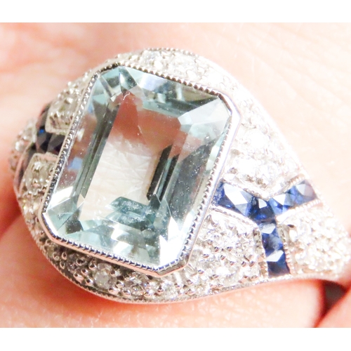 532 - Emerald Cut Aquamarine, Diamond and Sapphire Cluster Ring Mounted in Platinum Ring Size N