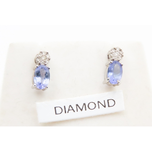 537 - Pair of Pale Tanzanite and Diamond Cluster Set Earrings Mounted in 18 Carat White Gold 1cm High