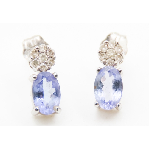 537 - Pair of Pale Tanzanite and Diamond Cluster Set Earrings Mounted in 18 Carat White Gold 1cm High