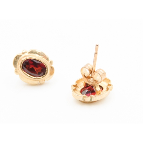 544 - Pair of Bezel Set Red Garnet Earrings Mounted in 9 Carat Yellow Gold 1cm High