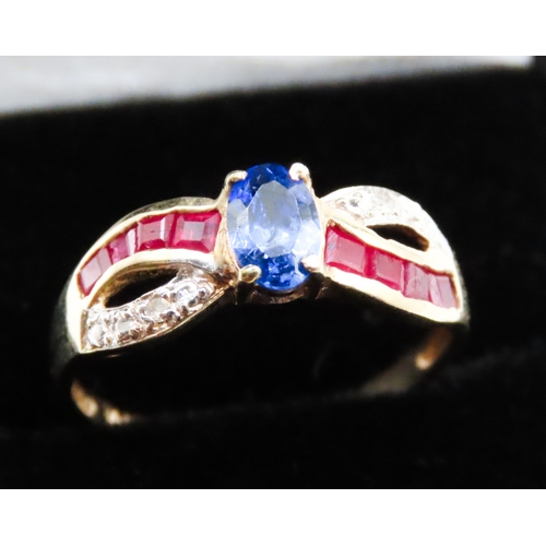 55 - Tanzanite Ruby and Diamond Set Crossover Form Ring Mounted in 10 Carat Yellow Gold Ring Size N