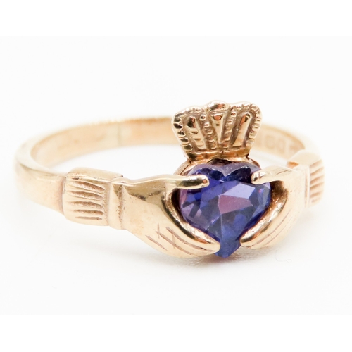 560 - Amethyst Set Claddagh Ring Mounted in 9 Carat Yellow Gold Ring Size P and a Half