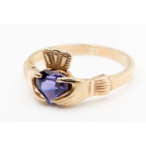 560 - Amethyst Set Claddagh Ring Mounted in 9 Carat Yellow Gold Ring Size P and a Half