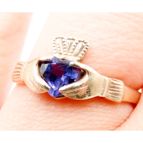 560 - Amethyst Set Claddagh Ring Mounted in 9 Carat Yellow Gold Ring Size P and a Half