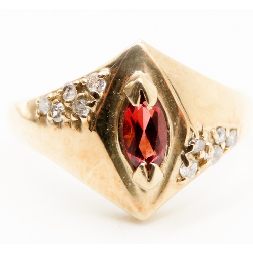 563 - Marquise Cut Red Garnet and Diamond Set Ring Attractively Detailed Mounted in 9 Carat Yellow Gold Ri... 