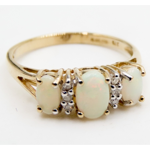 596 - Three Stone Opal and Diamond Set Ladies Ring Mounted in 9 Carat Yellow Gold Ring Size K