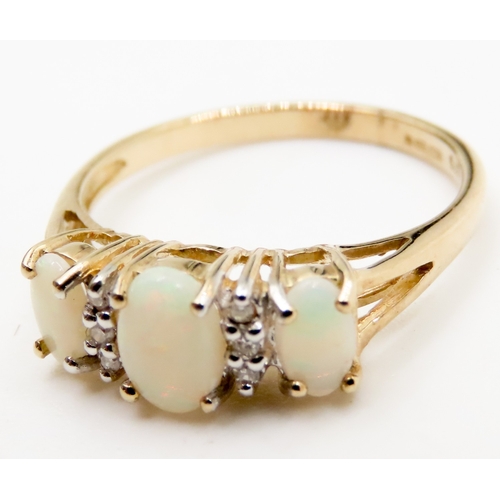 596 - Three Stone Opal and Diamond Set Ladies Ring Mounted in 9 Carat Yellow Gold Ring Size K