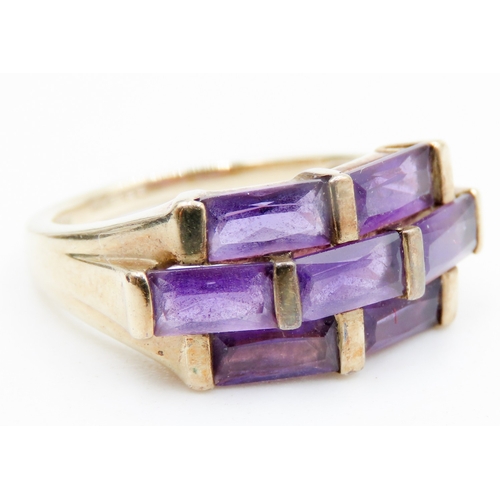 612 - Seven Stone Baguette Cut Amethyst Ring Mounted in 9 Carat Yellow Gold Ring Size K