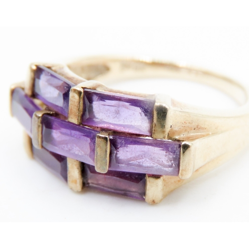 612 - Seven Stone Baguette Cut Amethyst Ring Mounted in 9 Carat Yellow Gold Ring Size K