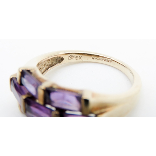 612 - Seven Stone Baguette Cut Amethyst Ring Mounted in 9 Carat Yellow Gold Ring Size K