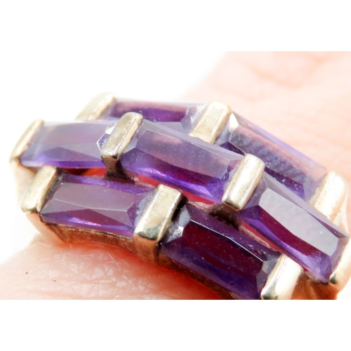 612 - Seven Stone Baguette Cut Amethyst Ring Mounted in 9 Carat Yellow Gold Ring Size K