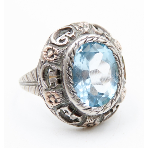 623 - Sky Blue Topaz Single Stone Ring Bezel Set Mounted on Gold Set Silver Band Ring Size O