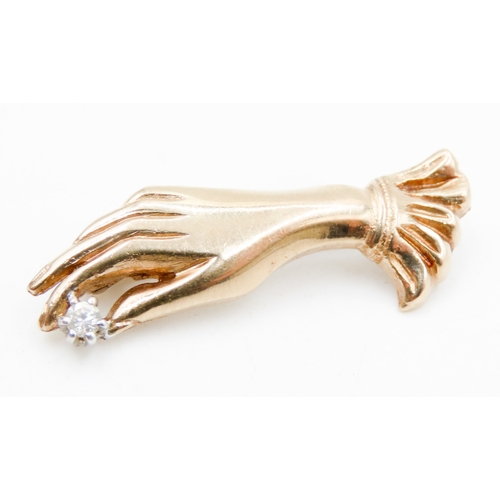 628 - 9 Carat Yellow Gold Gloved Hand Holding Diamond Brooch 2.5cm Long