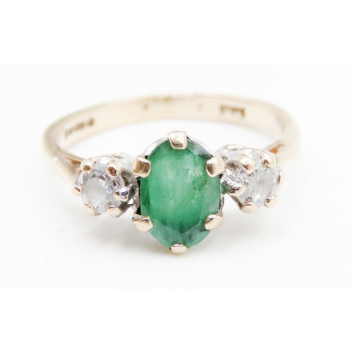 640 - Emerald and Gemstone Set Three Stone Ring Mounted in 9 Carat Yellow Gold Ring Size I