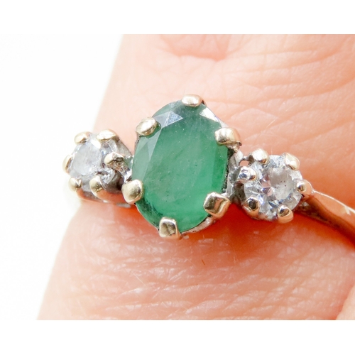 640 - Emerald and Gemstone Set Three Stone Ring Mounted in 9 Carat Yellow Gold Ring Size I