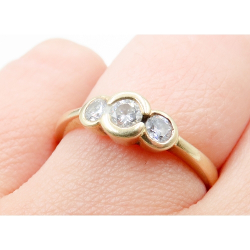 643 - Bezel Set Diamond Three Stone Ring Mounted in 18 Carat Yellow Gold Ring Size S