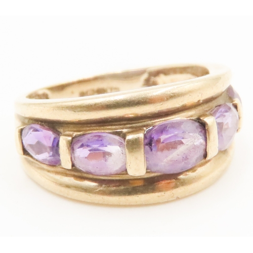 65 - Amethyst Five Stone Half Bezel Set Ring Mounted in 9 Carat Yellow Gold Ring Size P