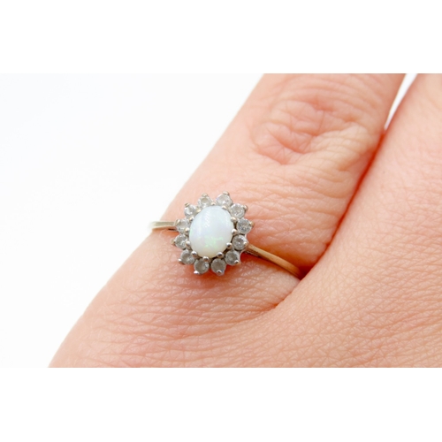 667 - Opal And Gemstone Set Ladies Cluster Ring Mounted in 9 Carat Yellow Gold Ring Size L