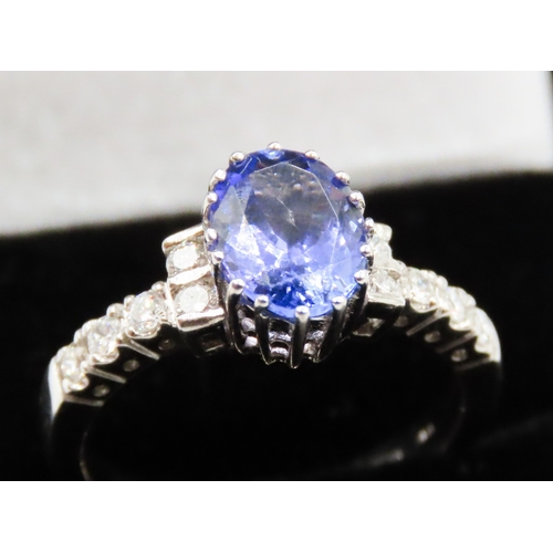 69 - Tanzanite Centre Stone Sixteen Claw Set Ring Further Diamonds Set to Shoulders Mounted in 14 Carat W... 