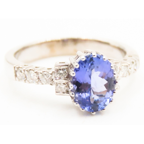 69 - Tanzanite Centre Stone Sixteen Claw Set Ring Further Diamonds Set to Shoulders Mounted in 14 Carat W... 