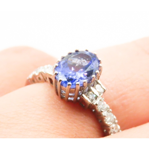 69 - Tanzanite Centre Stone Sixteen Claw Set Ring Further Diamonds Set to Shoulders Mounted in 14 Carat W... 