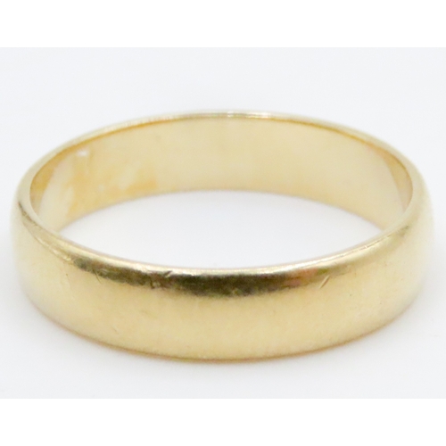 698 - 22 Carat Yellow Gold Band Ring Size K and a Half