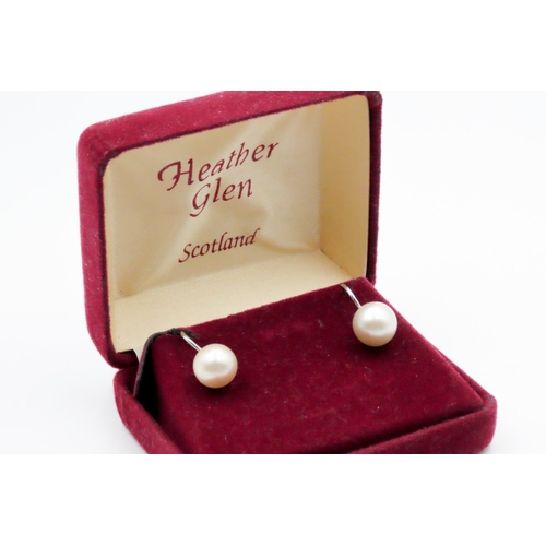 702 - Pair of Pearl Set Ladies Screw Earrings Mounted in 9 Carat White Gold