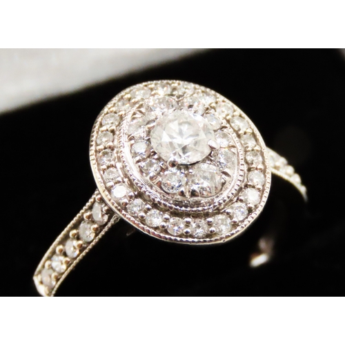 76 - Diamond Centre Stone Ring with Double Diamond Halo Surround Mounted in 18 Carat White Gold further D... 