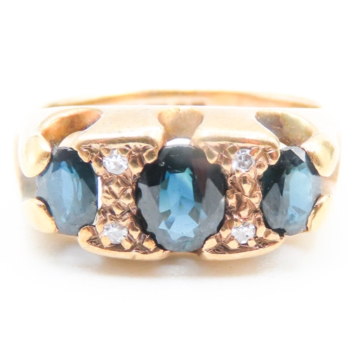 93 - Sapphire Three Stone Set Ring with Further Diamond Insets Mounted in 9 Carat Yellow Gold Ring Size I... 