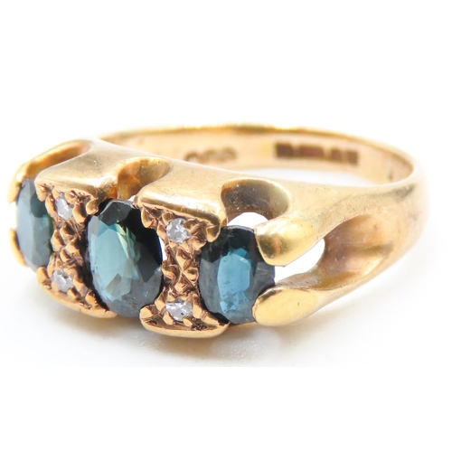 93 - Sapphire Three Stone Set Ring with Further Diamond Insets Mounted in 9 Carat Yellow Gold Ring Size I... 