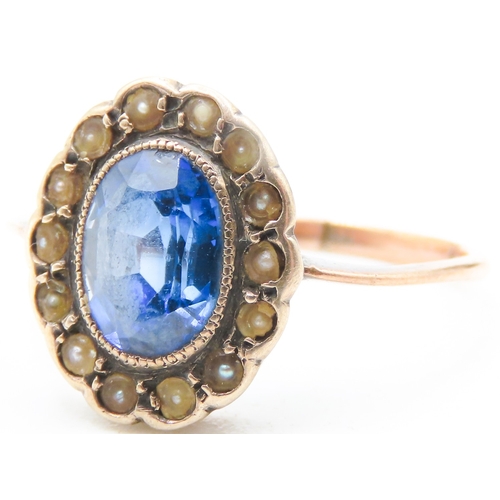 94 - Sapphire Centre Stone Ring with Seed Pearl Halo Surround Mounted on 9 Carat Rose Gold Ring Size N