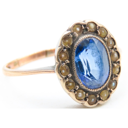 94 - Sapphire Centre Stone Ring with Seed Pearl Halo Surround Mounted on 9 Carat Rose Gold Ring Size N