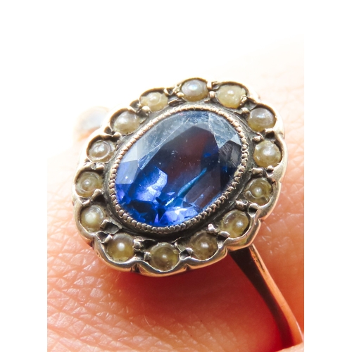 94 - Sapphire Centre Stone Ring with Seed Pearl Halo Surround Mounted on 9 Carat Rose Gold Ring Size N