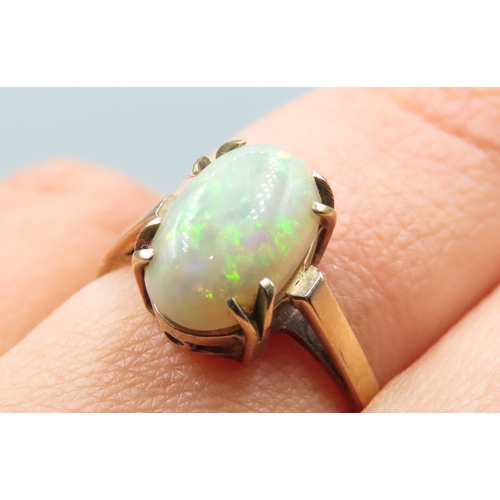 10 - Opal Single Stone Basket Set Ring Mounted in 9 Carat Yellow Gold Ring Size O and a Half