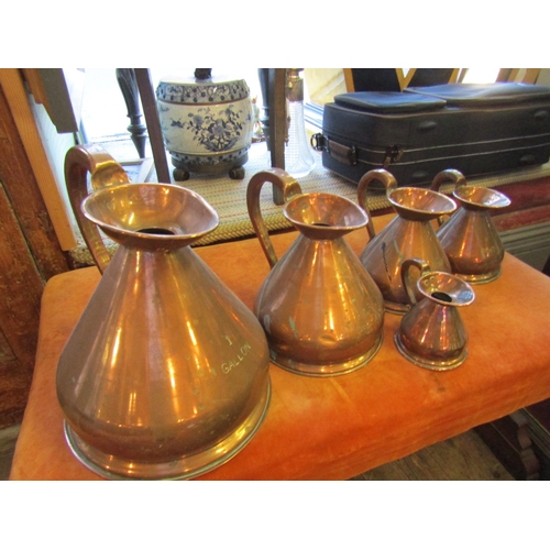 1040 - Set of Five Copper Measuring Jugs Graduated Sizes