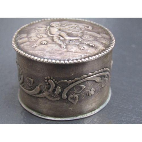 1058 - Silver Pill Box Antique with Cherub Motif Decoration to Cover Hinged Form