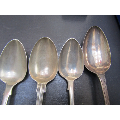 1128 - Four Silver Spoons Three Dessert Spoons and One Serving Spoon