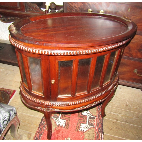 1200 - Carved Mahogany Oval Form Butlers Tray on Glassed Stand Single Door Drinks Cabinet Above Shaped Supp... 