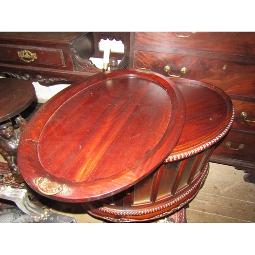 1200 - Carved Mahogany Oval Form Butlers Tray on Glassed Stand Single Door Drinks Cabinet Above Shaped Supp... 