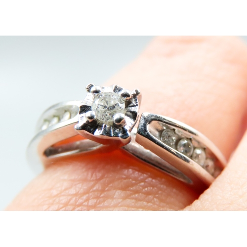 13 - Diamond Solitaire with Further Diamonds Set to Shoulders Mounted in 9 Carat White Gold Ring Size M